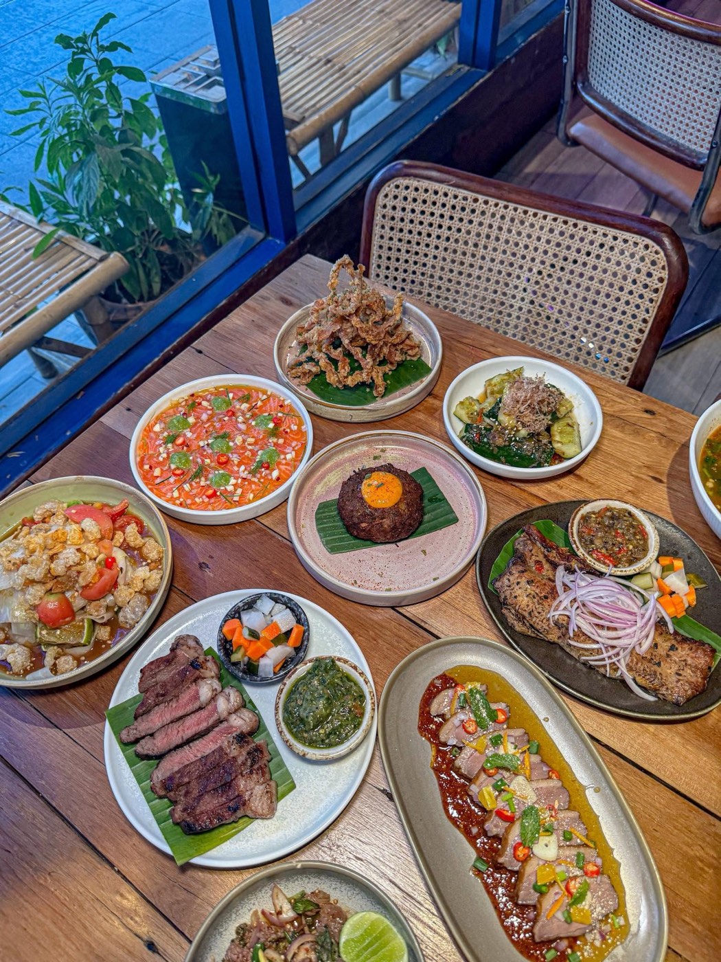 Shared table spread of Isan dishes